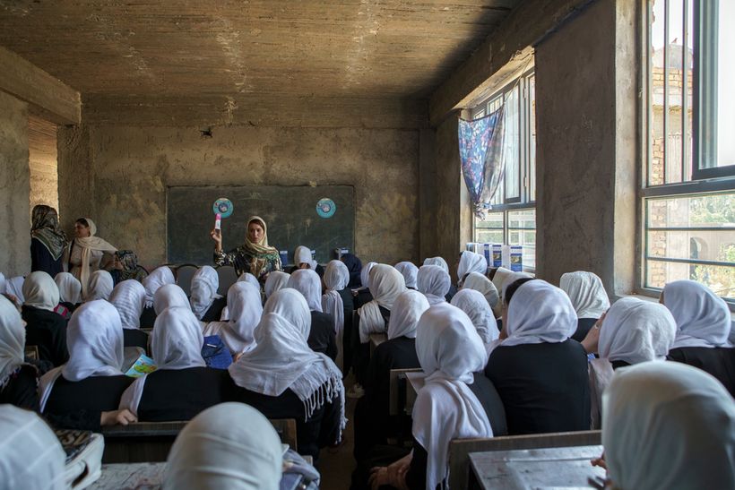 Afghan girls sat in classroom in school in Herat. Afghanistan