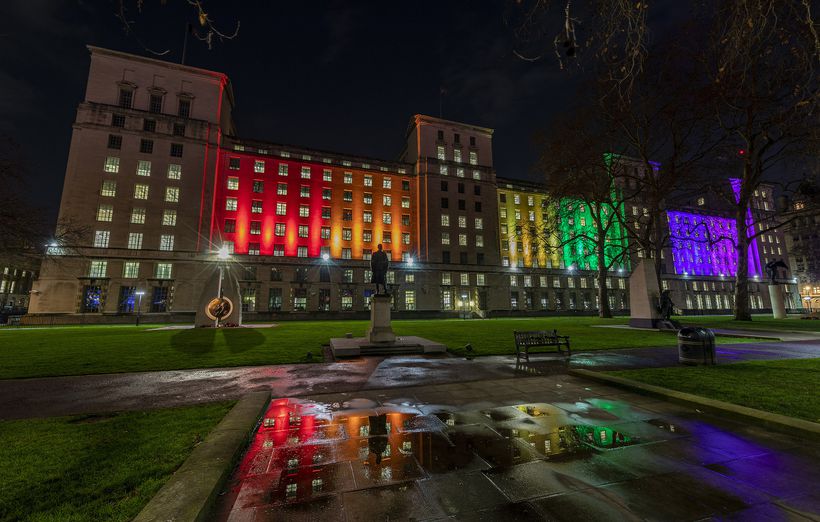 Ministry of Defence lit up in rainbow colours at night
