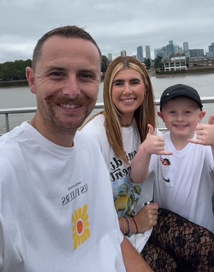 Photo shows Cohen Carberry (right) with his mum and dad