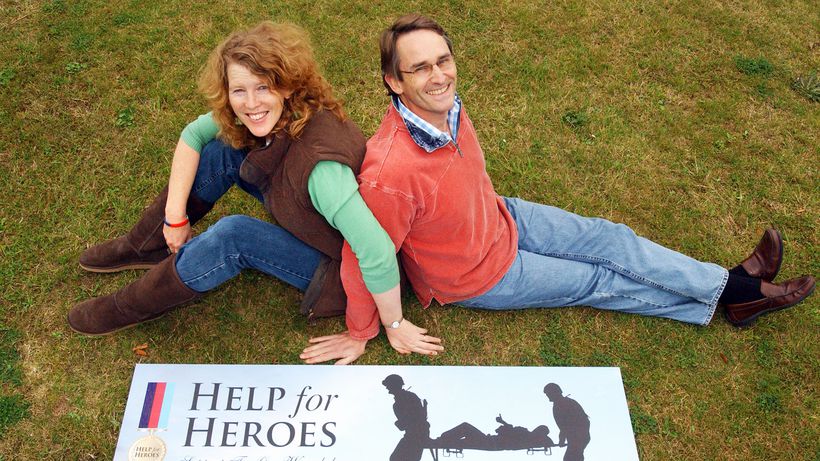 Bryn and Emma with the Help for Heroes logo and banner