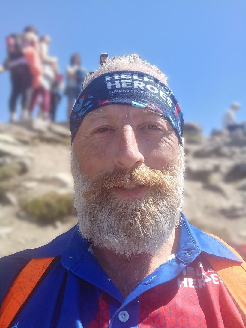 Image shows a close up of Colin, with a Help for Heroes bandana