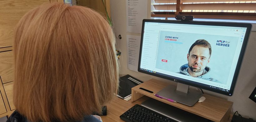 woman on laptop doing low mood self help course