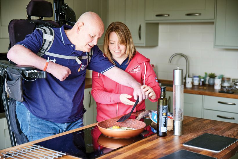 Veteran John and his partner Claire together at their home