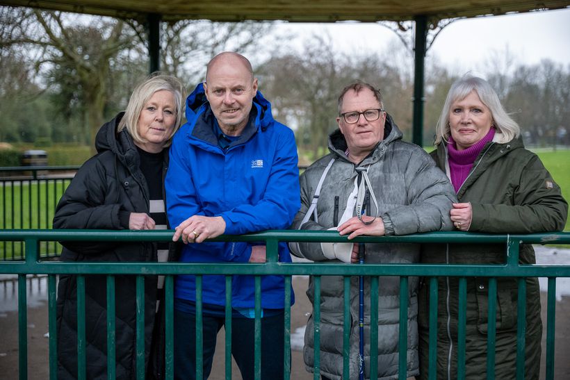 Four people stood together.