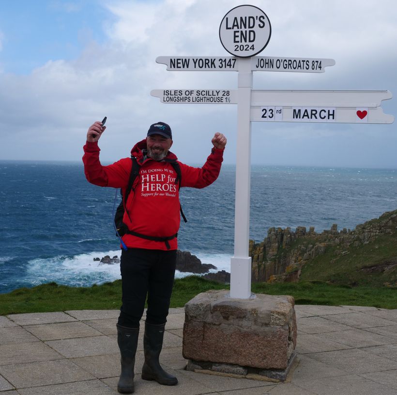 Man at Land's End sign