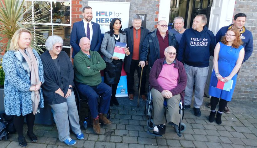 Suella Braverman MP poses for the media with veterans