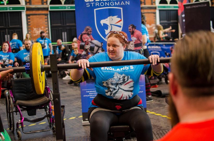 Weightlifter in a wheelchair prepares to lift