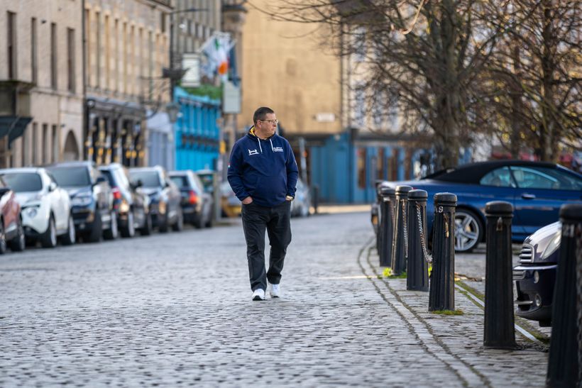 Brian walking in his local town
