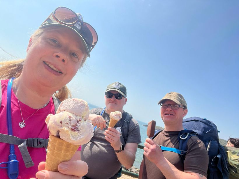 Three walkers enjoying large ice creams
