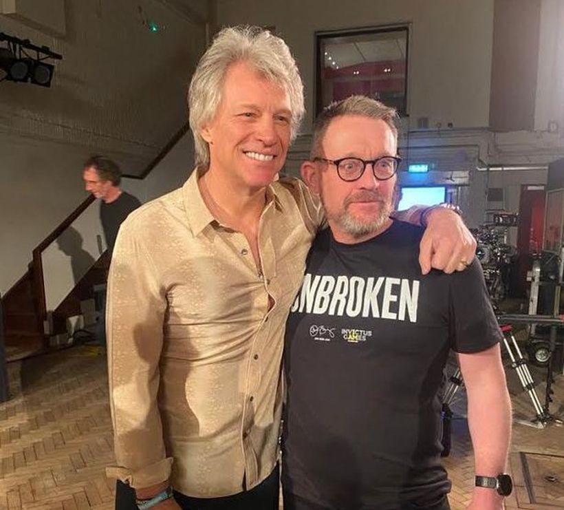 Gary stands with Bon Jovi