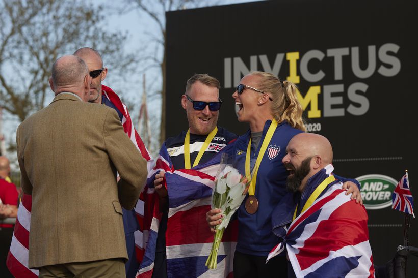 Mark is presented with a gold medal in athletics