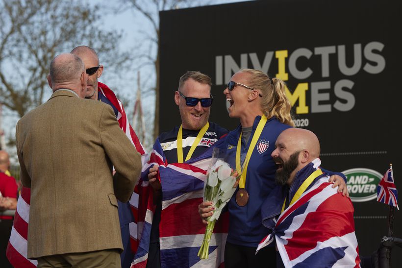 mark is presented with a gold medal in athletics