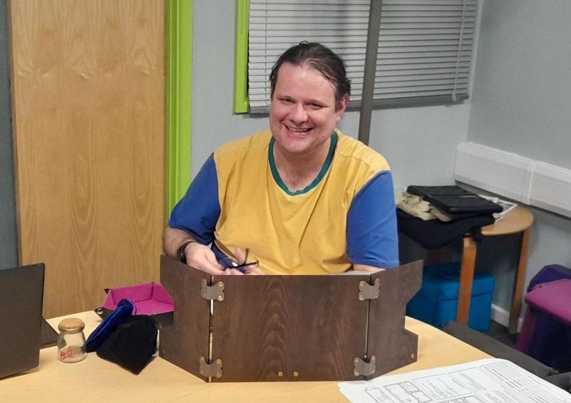 Image shows Gordon in a yellow and blue T-shirt