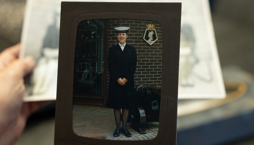 A framed photograph of Elaine in a navy uniform and white cap