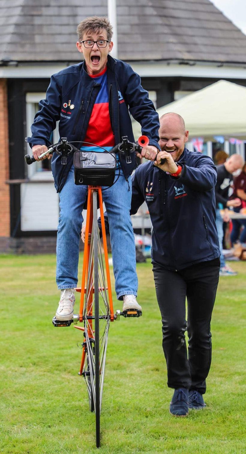 Paula riding a Penny Farthing bicycle