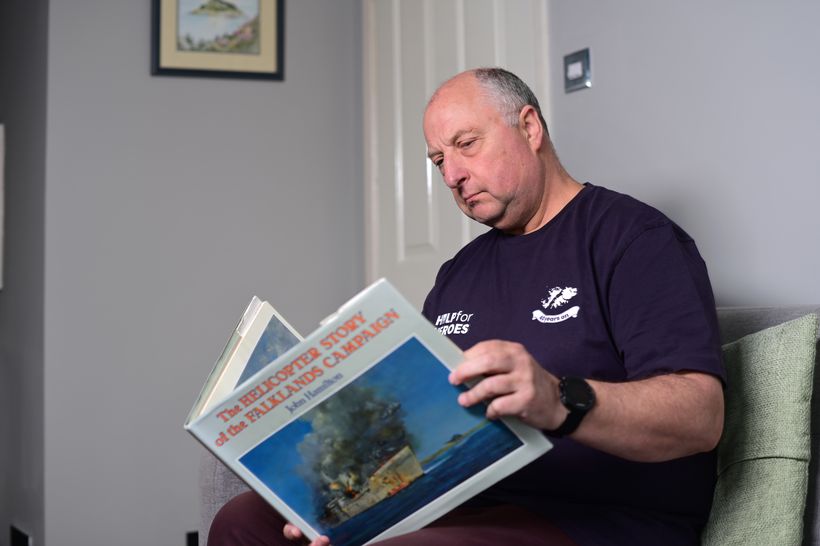 Veteran Nick Martin reads a Falklands book