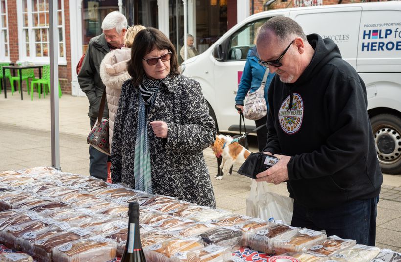 Members of the public at a cake stall