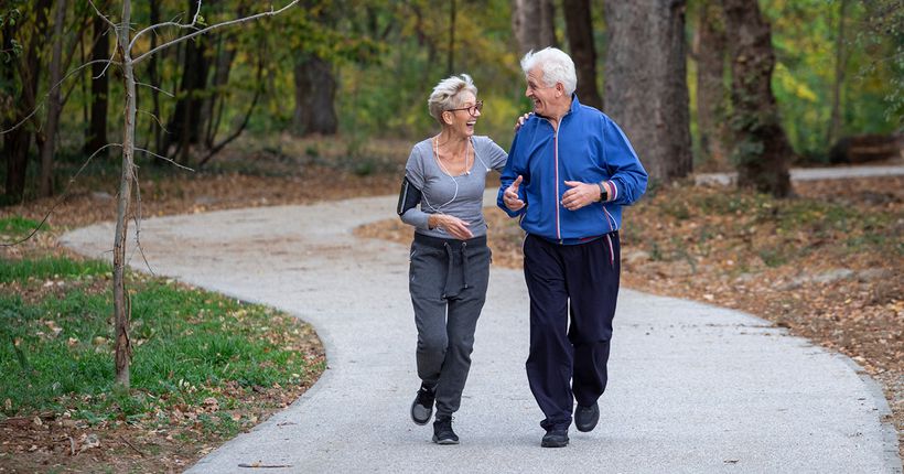 Woman and man jogging together outdoors