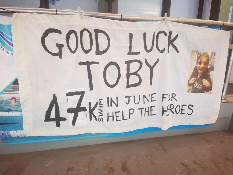 Image shows a banner with a message of support for Toby