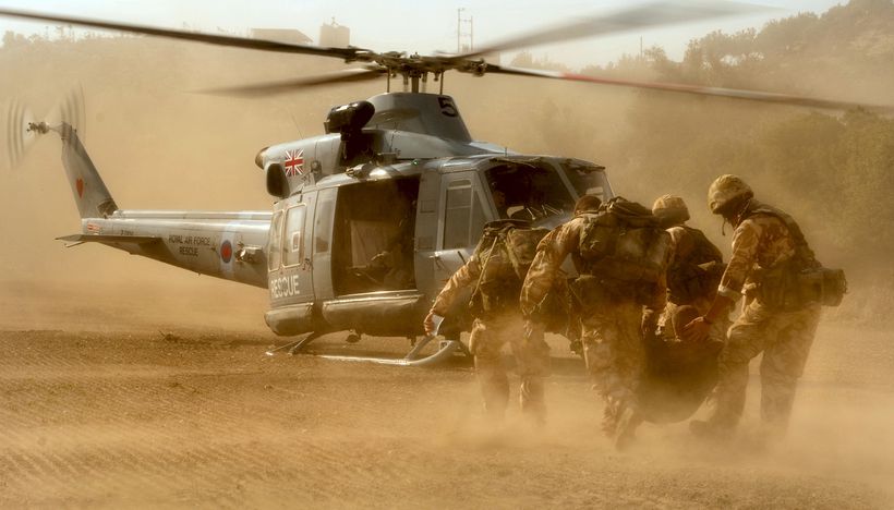 Men carry causality towards helicopter