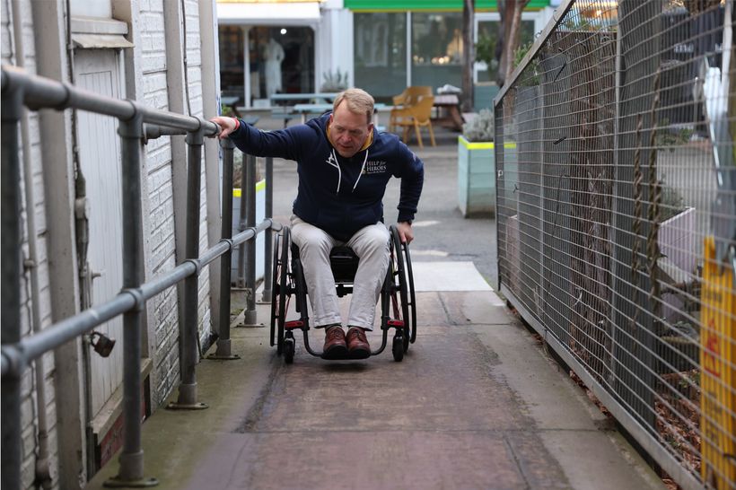 Image of David using a wheelchair ramp