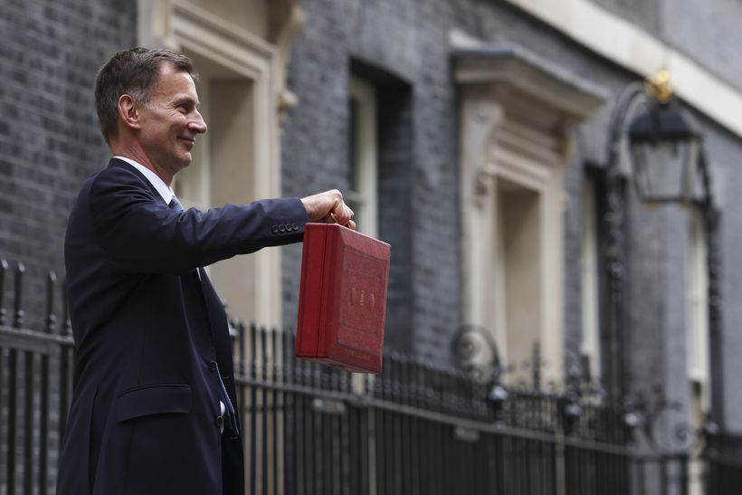 Chancellor of the Exchequer Jeremy Hunt holding red briefcase