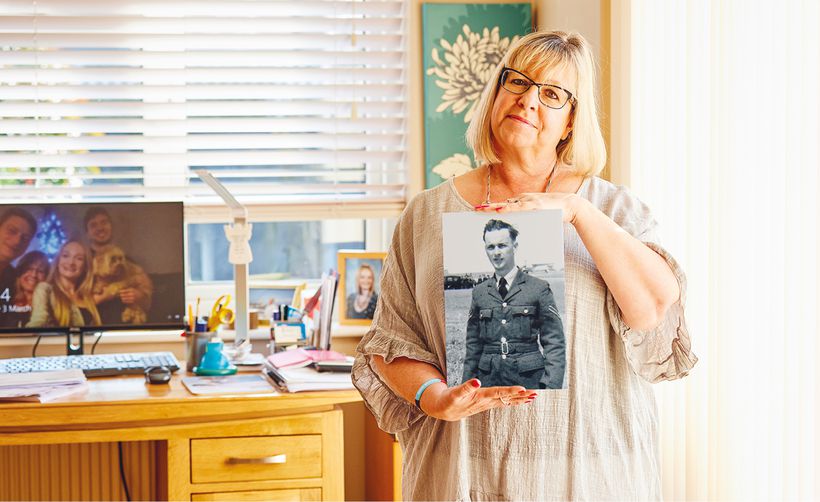 Carole holding photo of her father