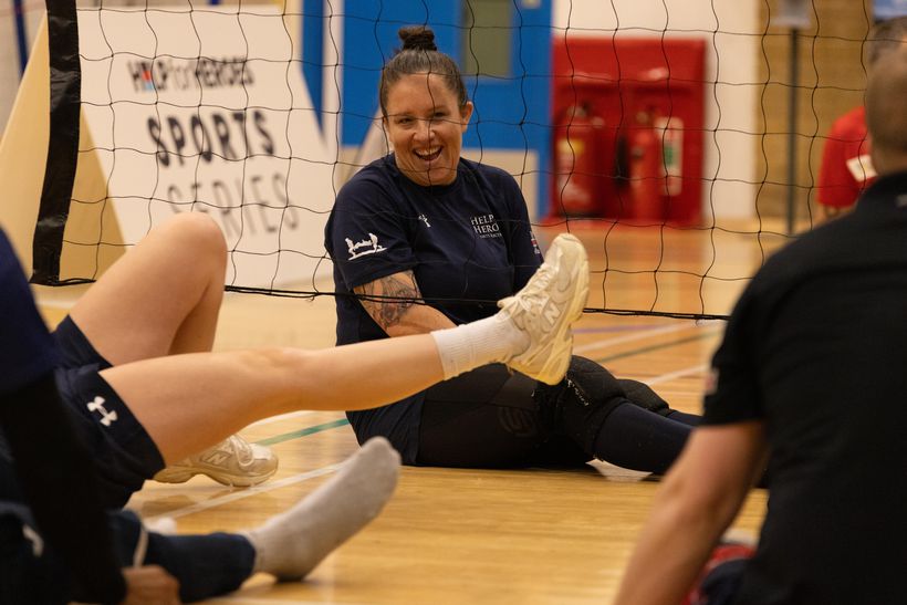 a veteran plays sitting volley ball at our sports series