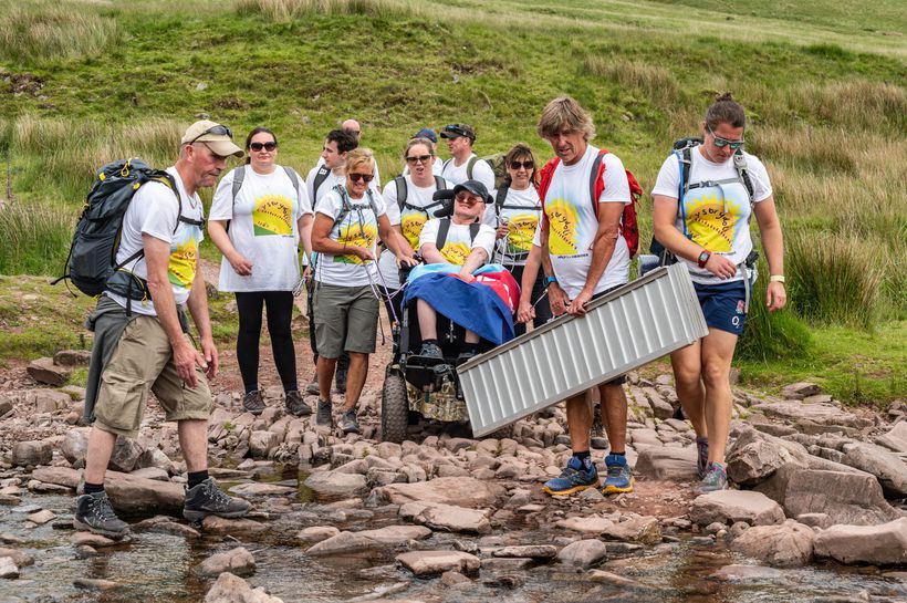 The team prepares to cross a stream (courtesy Jason Tamplin Pho