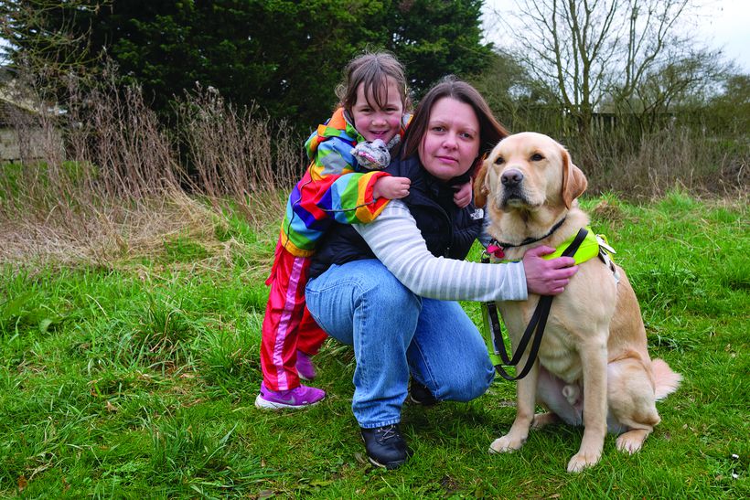 veteran Kelly with her daughter and dog