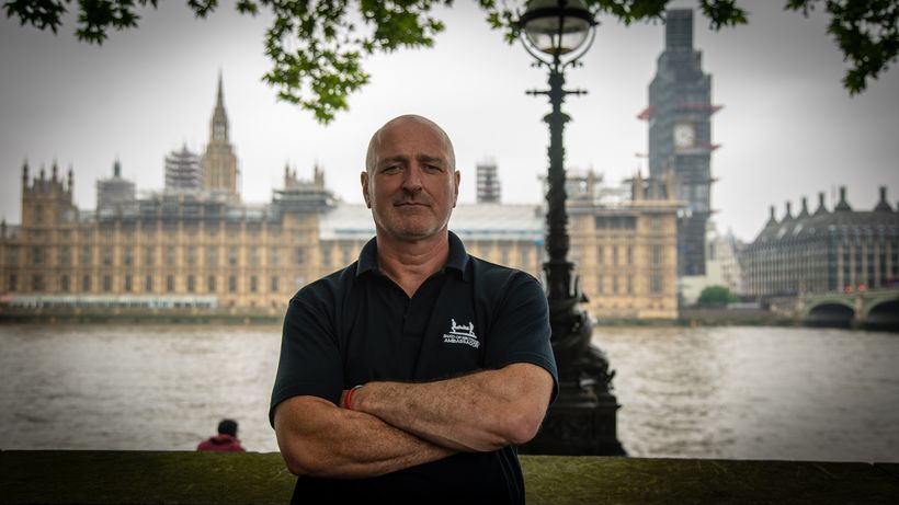 Barrie Griffiths stood in front of the Houses of Parliament