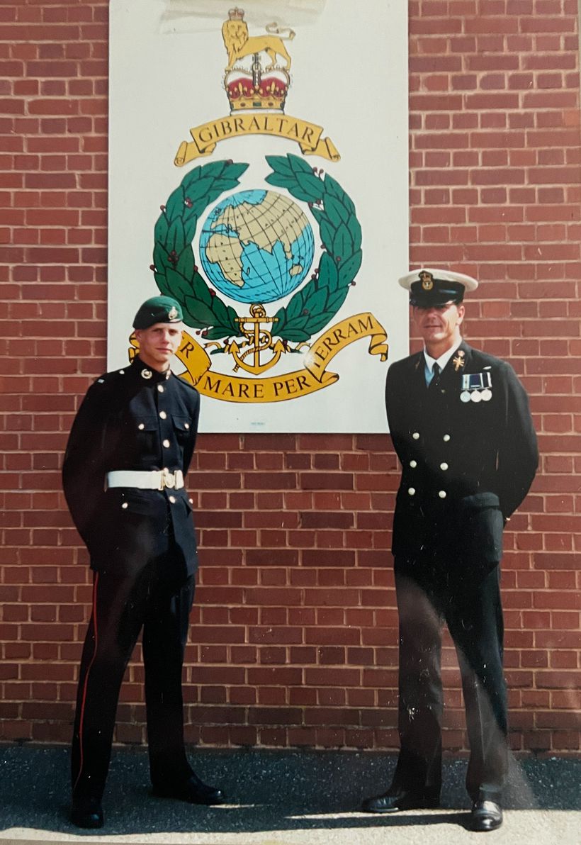 Veterans in front of RM crest