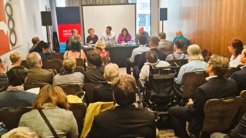 Panel of five people facing audience