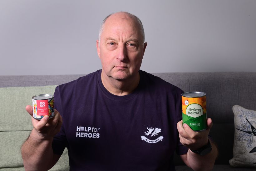 Veteran Nick Martin holds tins