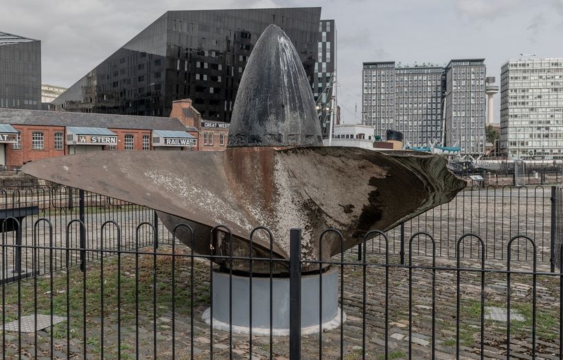 A ship propeller surrounded by gates