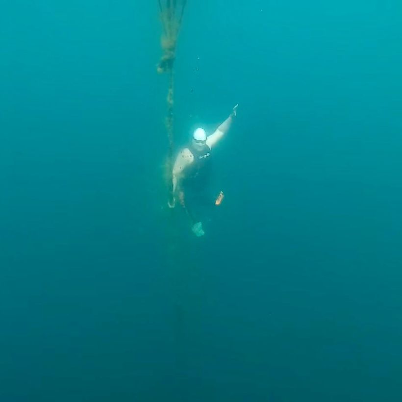 Simon deep diving under water