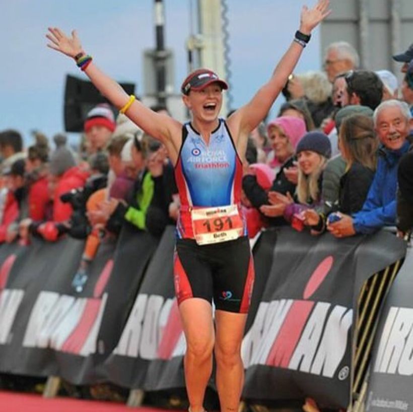 Female veteran crosses finish line after triathlon