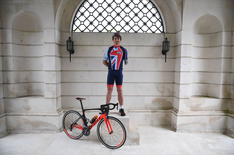 Jaco Van Gass on a winners podium with his bike