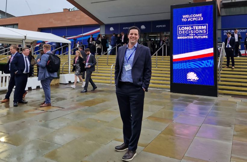 Help for Heroes CEO James Needham in standing by noticeboard