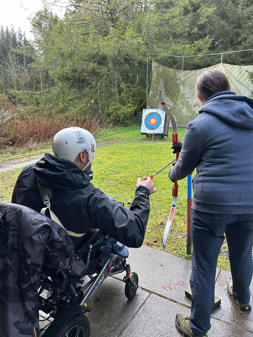Matt Shaw sat in a wheelchair at an archery session