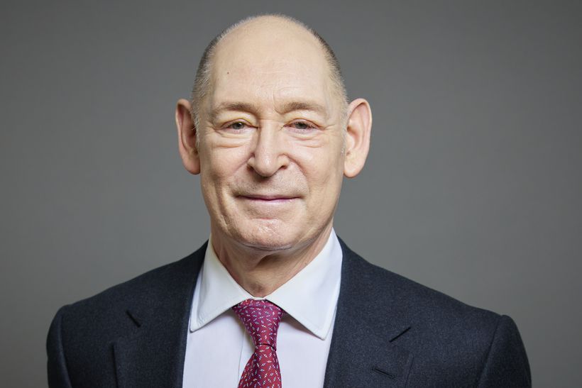 Portrait photo of Lord Etherton KC wearing red tie