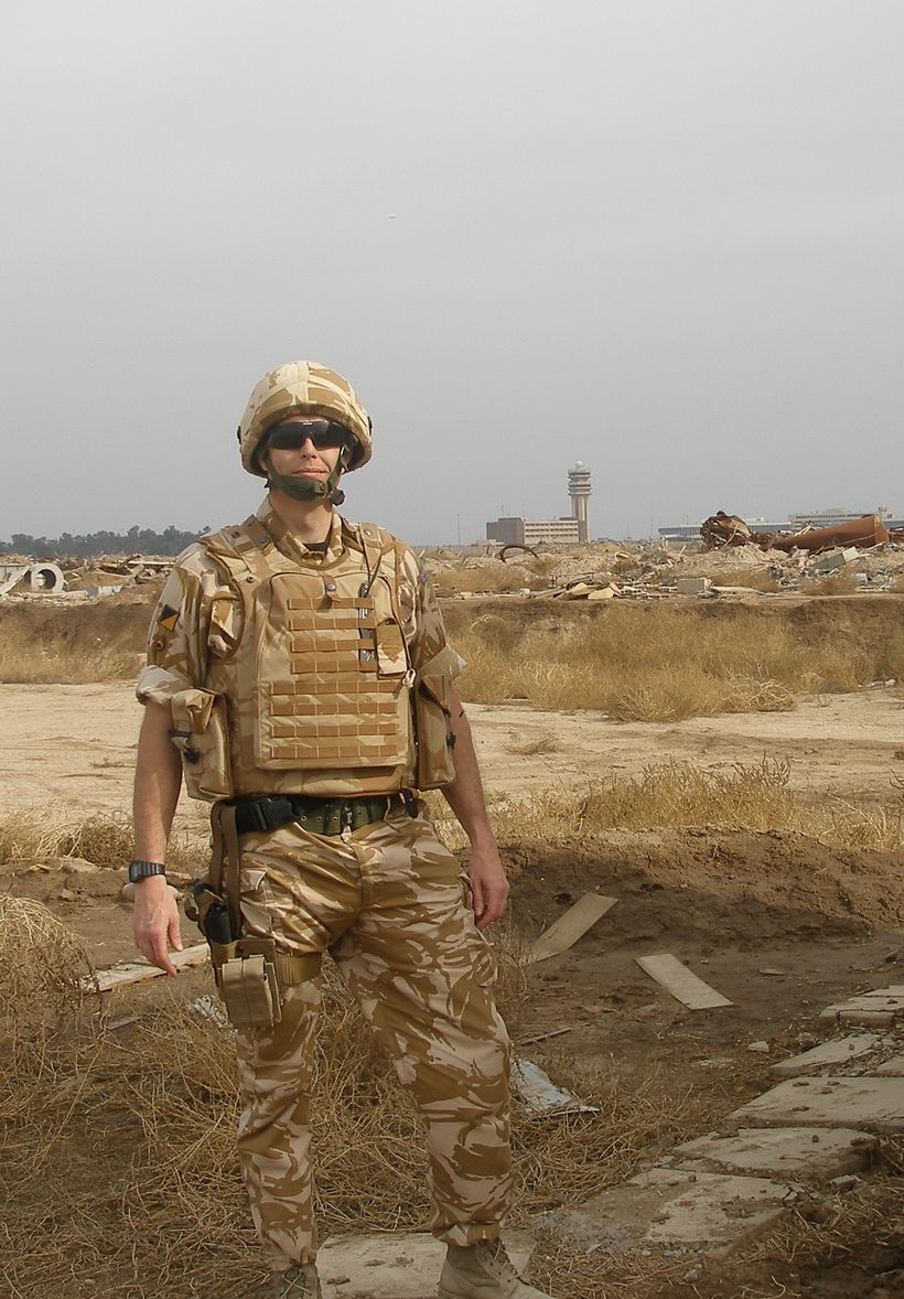 A man in military fatigues at Baghdad airport.
