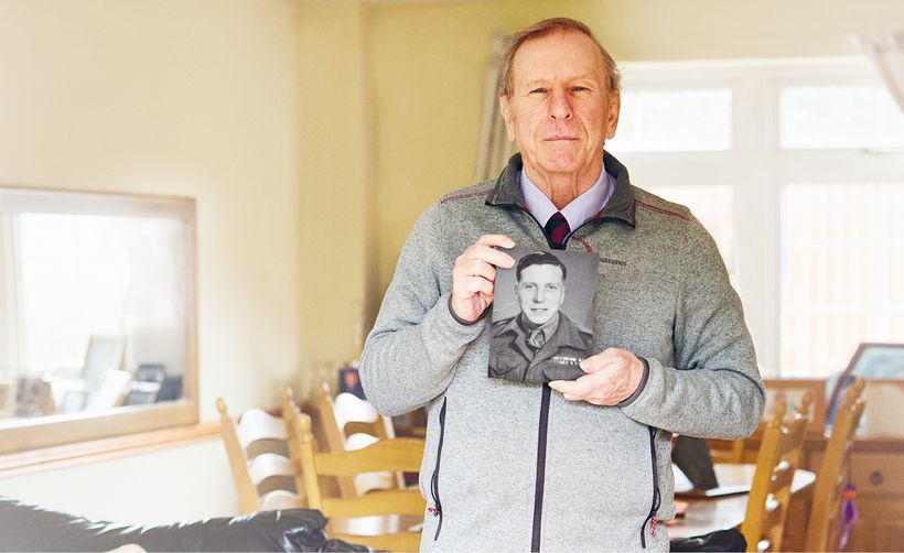 Bob holding photo of his father